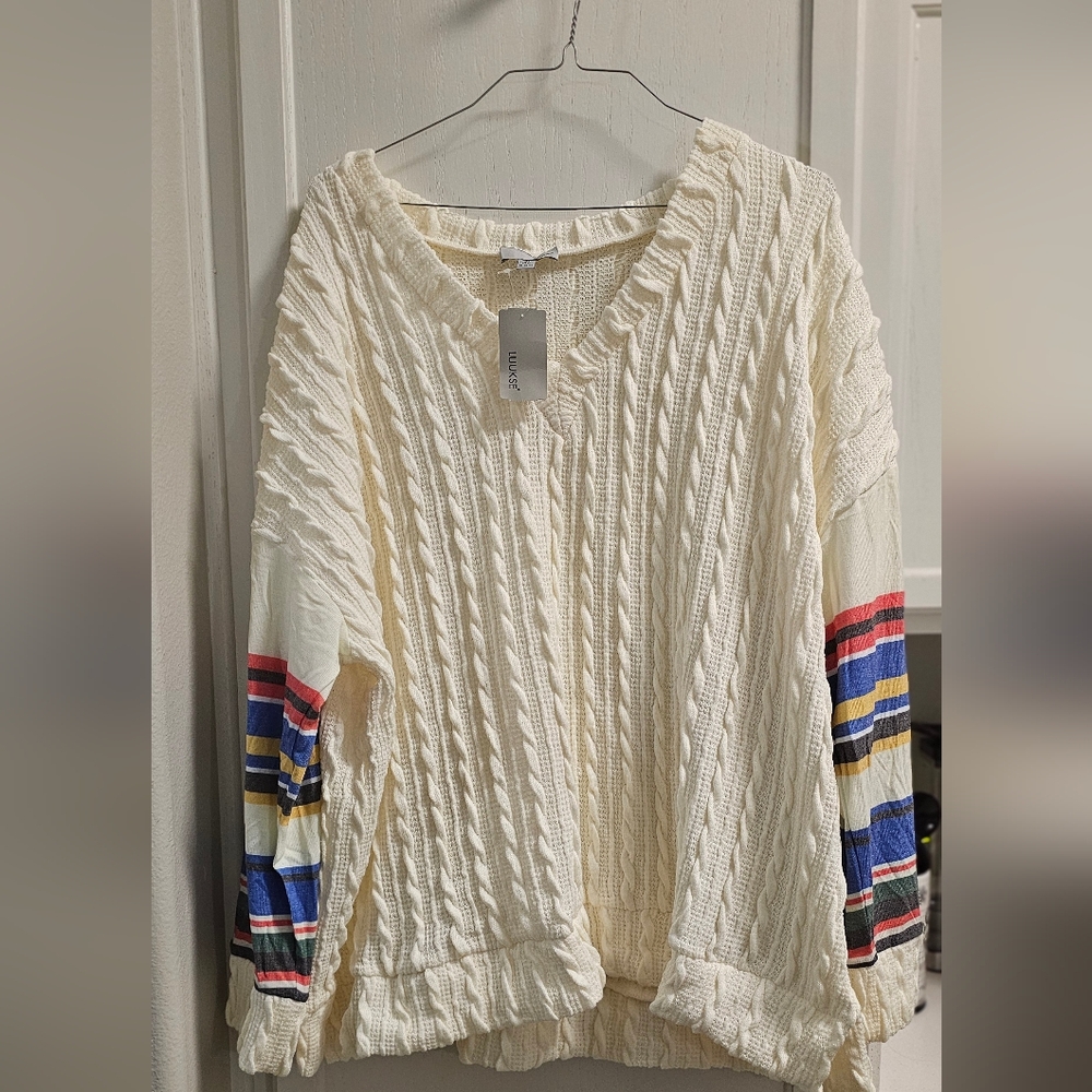NWT cream sweater with colorful striped sleeves